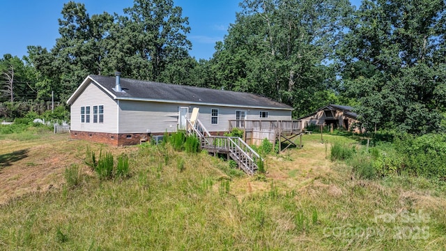6314 Providence Church Rd, Vale, NC 28168 - rear view of house with crawl space, stairway, and a wooden deck
