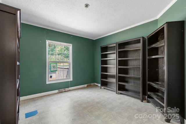 6314 Providence Church Rd, Vale, NC 28168 - unfurnished bedroom with a textured ceiling, ornamental molding, and light flooring