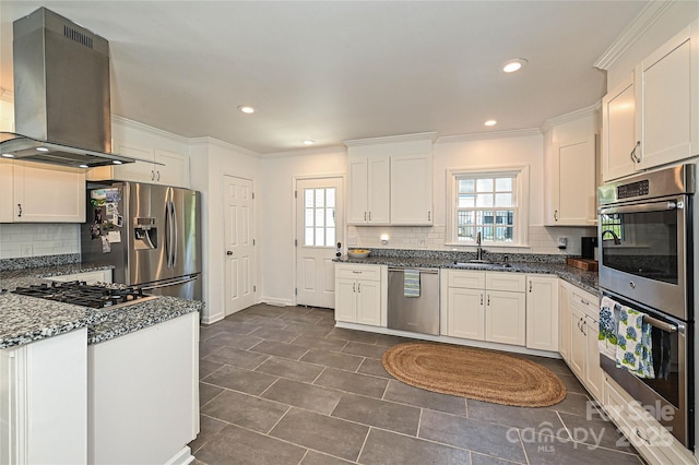 5301 Addison Dr, Charlotte, NC 28211 - kitchen featuring appliances with stainless steel finishes, wall chimney exhaust hood, decorative backsplash, healthy amount of natural light, and crown molding
