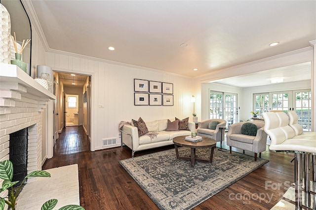 5301 Addison Dr, Charlotte, NC 28211 - living room with ornamental molding, dark wood-style flooring, a brick fireplace, and recessed lighting