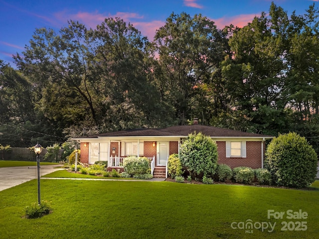 331 Elwood St, Kannapolis, NC 28081 - ranch-style home featuring brick siding, a yard, and concrete driveway