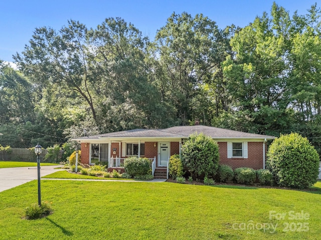 331 Elwood St, Kannapolis, NC 28081 - view of front of home with a front lawn and brick siding