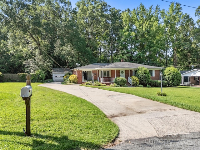 331 Elwood St, Kannapolis, NC 28081 - ranch-style home featuring a porch, brick siding, driveway, and a front lawn