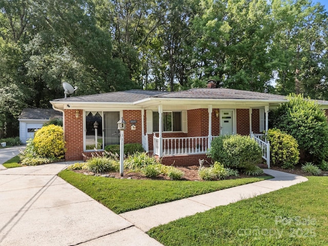 331 Elwood St, Kannapolis, NC 28081 - view of front of home with brick siding, covered porch, a front yard, and a chimney