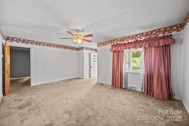 331 Elwood St, Kannapolis, NC 28081 - empty room with ceiling fan, carpet, and a textured ceiling
