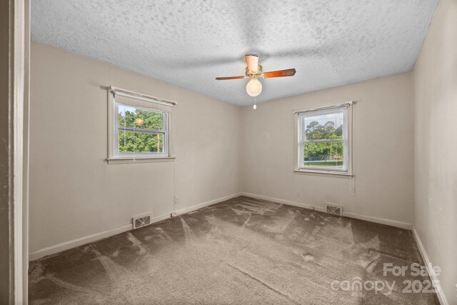 331 Elwood St, Kannapolis, NC 28081 - carpeted spare room with ceiling fan and a textured ceiling