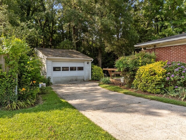 331 Elwood St, Kannapolis, NC 28081 - detached garage with concrete driveway and view of scattered trees