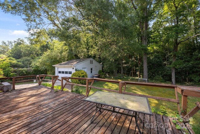 331 Elwood St, Kannapolis, NC 28081 - wooden terrace featuring an outdoor structure, a detached garage, and a yard
