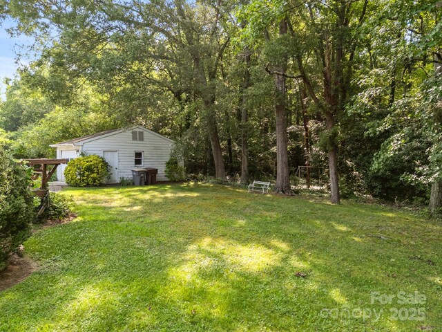 331 Elwood St, Kannapolis, NC 28081 - view of grassy yard with an outdoor structure and a garage