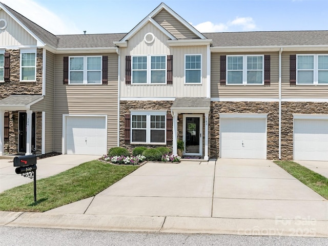 342 Battery Cir, Clover, SC 29710 - multi unit property featuring stone siding, driveway, board and batten siding, and an attached garage