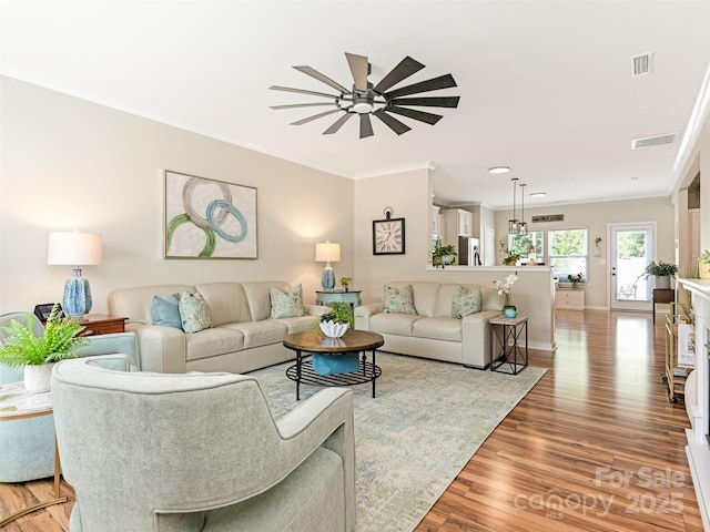 342 Battery Cir, Clover, SC 29710 - living room featuring a ceiling fan, ornamental molding, and light wood finished floors