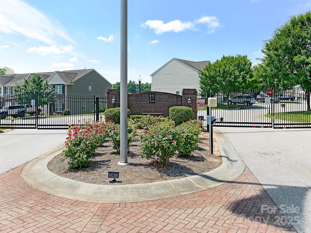 342 Battery Cir, Clover, SC 29710 - view of asphalt road featuring a gated entry, a gate, curbs, and sidewalks