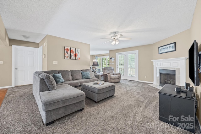1921 Williford Woods Ln, Rock Hill, SC 29730 - living area with a ceiling fan, a textured ceiling, carpet, and a tile fireplace