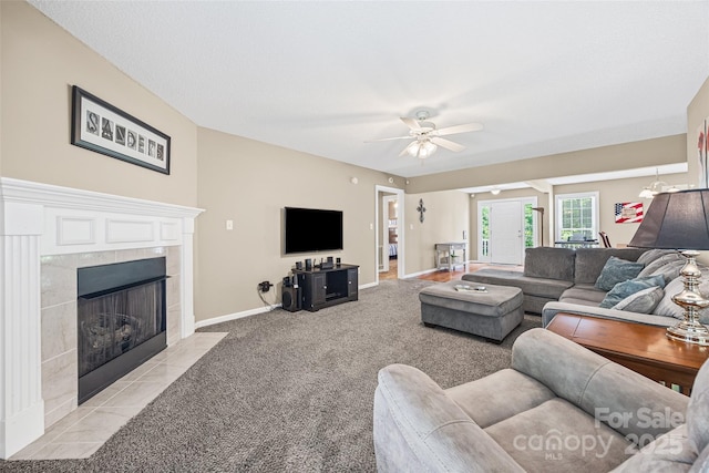 1921 Williford Woods Ln, Rock Hill, SC 29730 - living room with light carpet, a tile fireplace, and ceiling fan