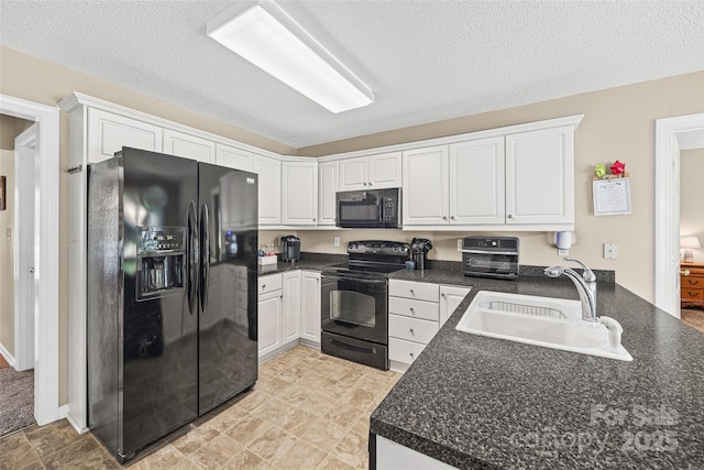 1921 Williford Woods Ln, Rock Hill, SC 29730 - kitchen featuring black appliances, dark countertops, white cabinetry, and a textured ceiling