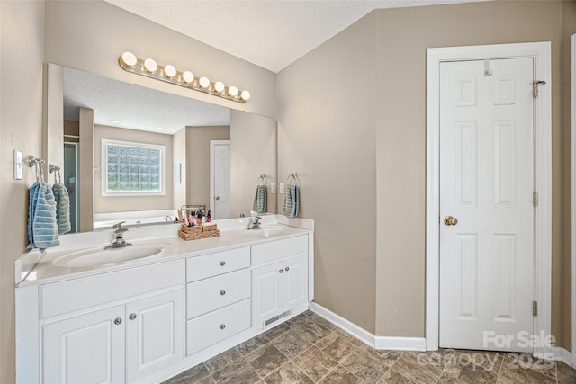 1921 Williford Woods Ln, Rock Hill, SC 29730 - full bathroom featuring a textured ceiling and double vanity