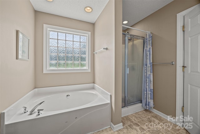 1921 Williford Woods Ln, Rock Hill, SC 29730 - full bath featuring a stall shower, a bath, a textured ceiling, and recessed lighting