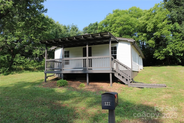 127 Setzer St, Spindale, NC 28160 - view of front of house featuring a front yard and a wooden deck