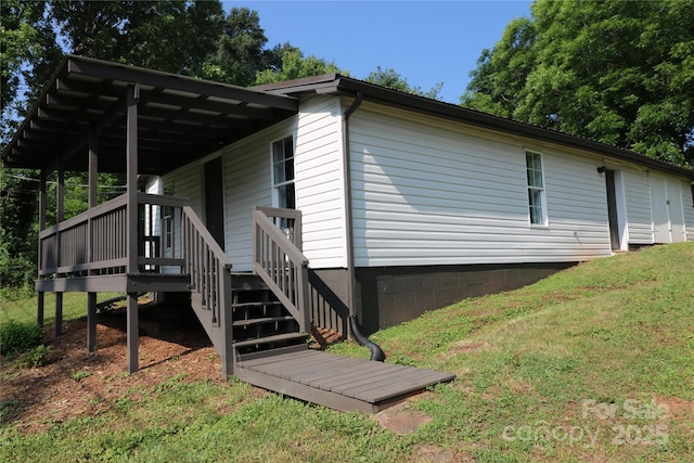 127 Setzer St, Spindale, NC 28160 - view of side of home with a deck, a lawn, and stairway