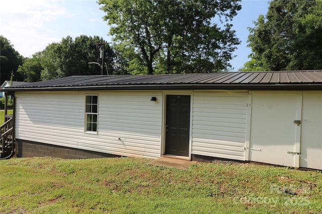 127 Setzer St, Spindale, NC 28160 - rear view of property featuring a lawn and a metal roof