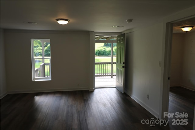 127 Setzer St, Spindale, NC 28160 - unfurnished room featuring healthy amount of natural light and dark wood-style floors