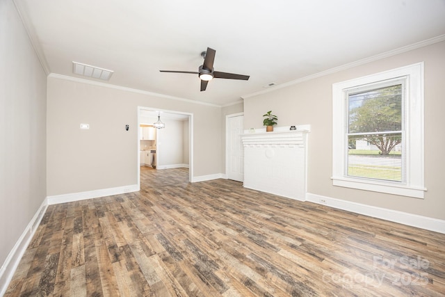 900 N Salisbury Ave, Spencer, NC 28159 - unfurnished living room featuring wood finished floors, crown molding, and a ceiling fan
