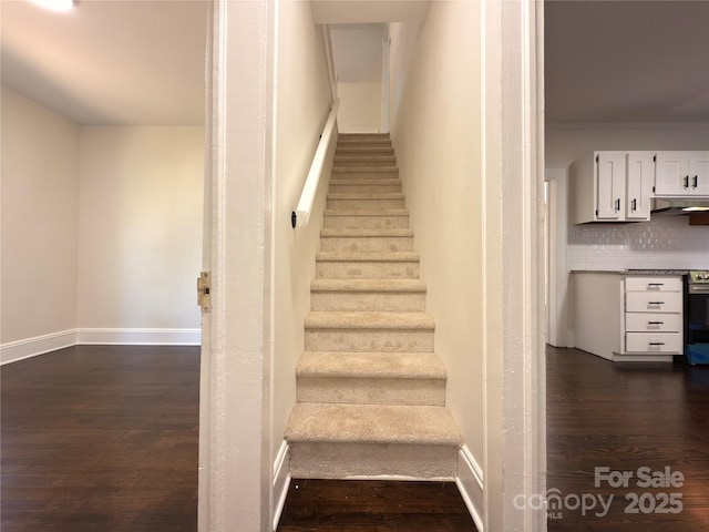 179 Duval St NW, Concord, NC 28025 - staircase with wood finished floors and baseboards