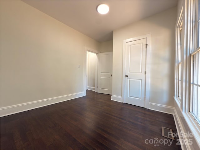 179 Duval St NW, Concord, NC 28025 - unfurnished bedroom with dark wood-style floors