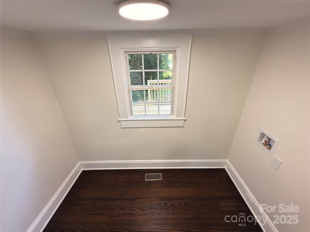 179 Duval St NW, Concord, NC 28025 - spare room with baseboards and dark wood finished floors