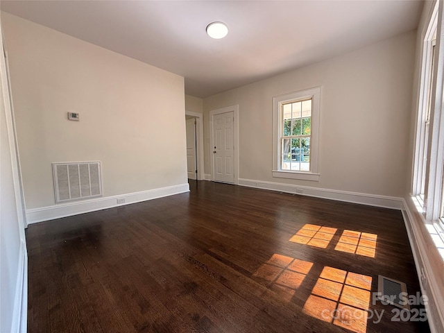 179 Duval St NW, Concord, NC 28025 - spare room with dark wood finished floors and baseboards