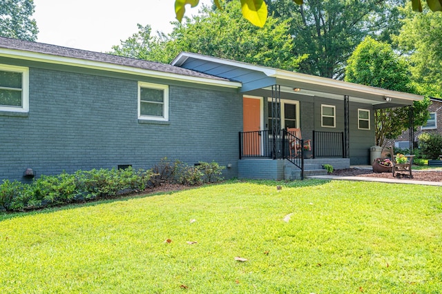 108 Graham St, Stanley, NC 28164 - view of front of home with a porch, a front yard, brick siding, and crawl space