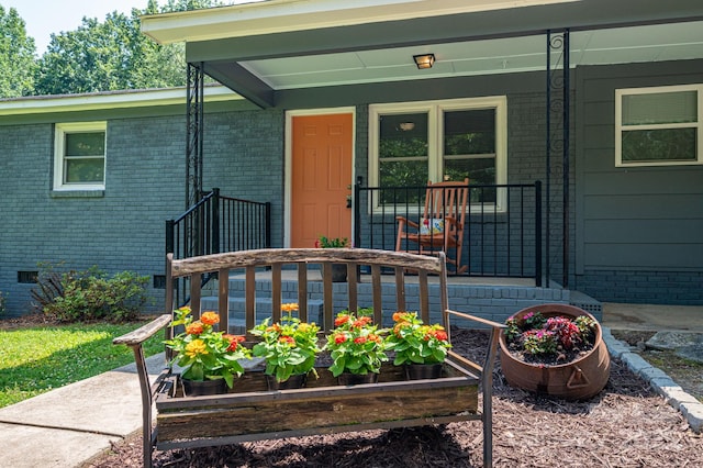 108 Graham St, Stanley, NC 28164 - doorway to property featuring a porch, brick siding, and crawl space