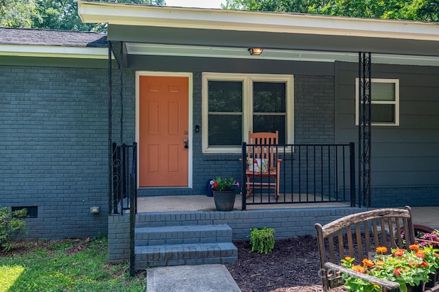 108 Graham St, Stanley, NC 28164 - entrance to property featuring a porch, brick siding, and crawl space