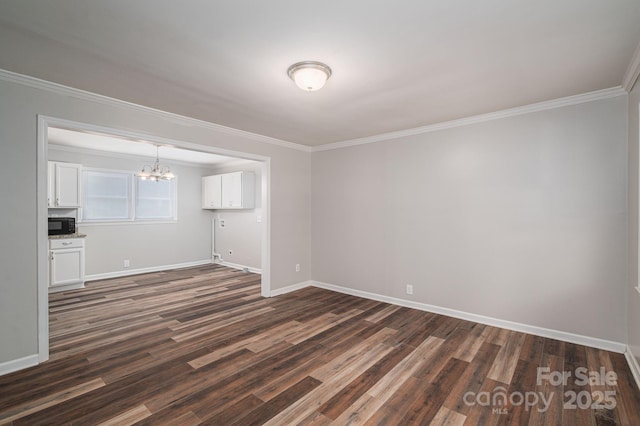 108 Graham St, Stanley, NC 28164 - empty room with a chandelier, dark wood-type flooring, and crown molding