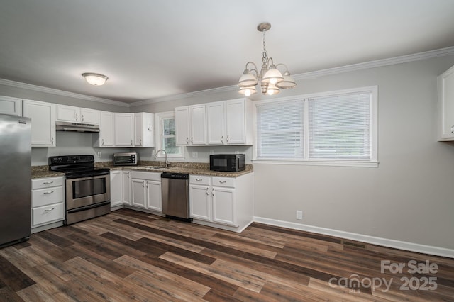 108 Graham St, Stanley, NC 28164 - kitchen with appliances with stainless steel finishes, under cabinet range hood, white cabinetry, a chandelier, and dark wood-type flooring