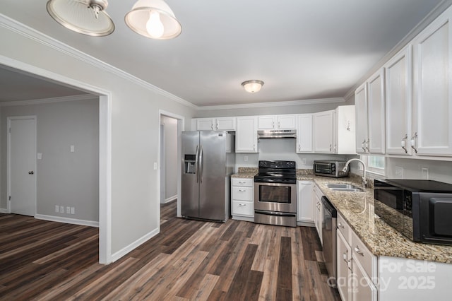 108 Graham St, Stanley, NC 28164 - kitchen featuring appliances with stainless steel finishes, under cabinet range hood, white cabinetry, dark wood-style flooring, and ornamental molding