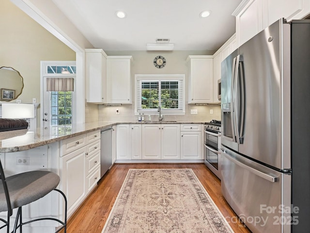 1842 Caroline Way, Fort Mill, SC 29715 - kitchen with stainless steel appliances, plenty of natural light, white cabinets, and recessed lighting