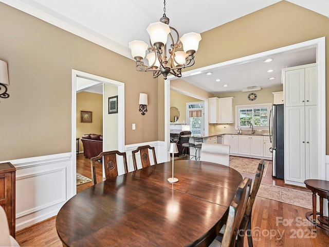 1842 Caroline Way, Fort Mill, SC 29715 - dining room featuring a chandelier, a wainscoted wall, dark wood-style flooring, and recessed lighting