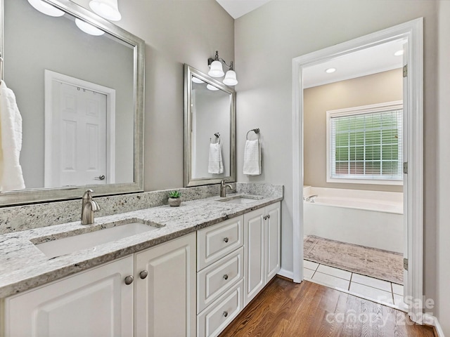 1842 Caroline Way, Fort Mill, SC 29715 - full bath featuring double vanity, a garden tub, and wood finished floors