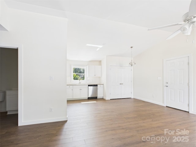 39 Pearl St, Granite Falls, NC 28630 - unfurnished living room with vaulted ceiling, a ceiling fan, and wood finished floors