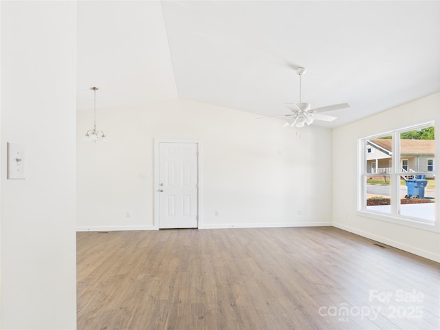 39 Pearl St, Granite Falls, NC 28630 - unfurnished room with wood finished floors, a chandelier, ceiling fan, and lofted ceiling
