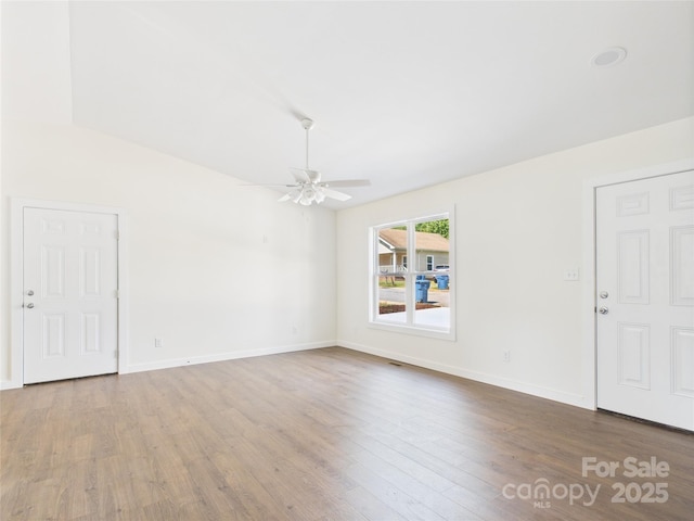 39 Pearl St, Granite Falls, NC 28630 - unfurnished living room featuring wood finished floors and a ceiling fan