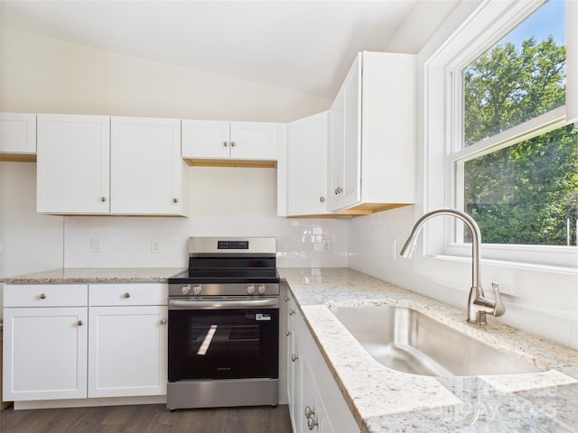 39 Pearl St, Granite Falls, NC 28630 - kitchen featuring electric stove, lofted ceiling, white cabinetry, light stone countertops, and decorative backsplash