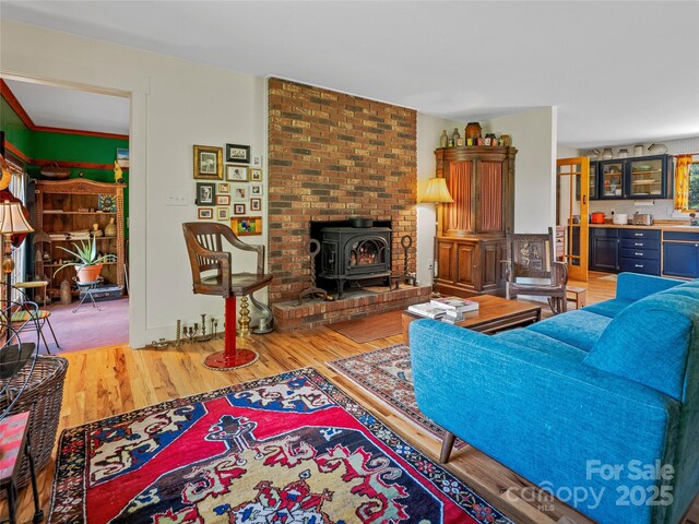 32 Sugar Cove Rd, Weaverville, NC 28787 - living room featuring wood finished floors, a wood stove, and bar area