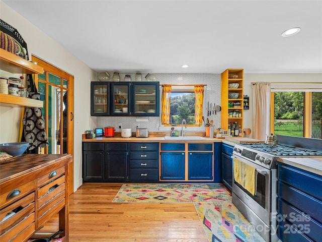 32 Sugar Cove Rd, Weaverville, NC 28787 - kitchen with stainless steel gas range oven, open shelves, light wood finished floors, light countertops, and recessed lighting