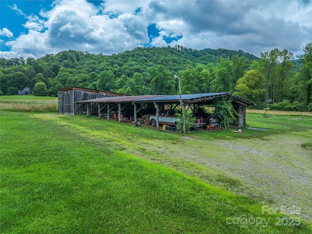 32 Sugar Cove Rd, Weaverville, NC 28787 - view of property's community with a view of trees, an outbuilding, and a lawn