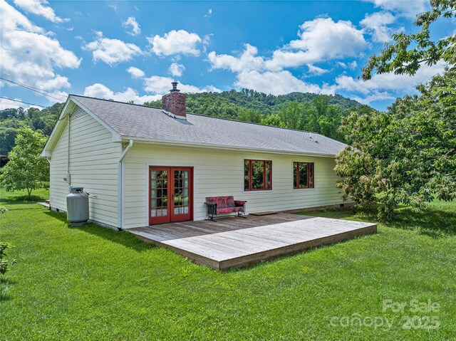 32 Sugar Cove Rd, Weaverville, NC 28787 - rear view of property featuring a deck, a yard, a chimney, french doors, and a shingled roof