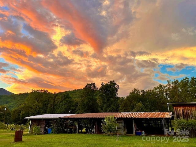 32 Sugar Cove Rd, Weaverville, NC 28787 - view of home's community featuring a lawn, a detached carport, an outbuilding, and a wooded view