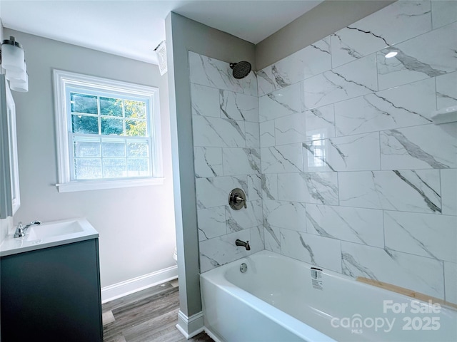 509 8th Avenue Ext, Cramerton, NC 28032 - bathroom featuring vanity, tub / shower combination, and wood finished floors