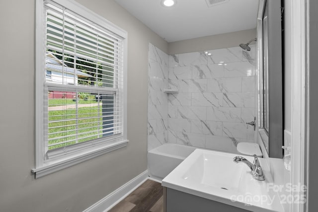 509 8th Avenue Ext, Cramerton, NC 28032 - full bathroom featuring healthy amount of natural light, wood finished floors, vanity,  shower combination, and recessed lighting